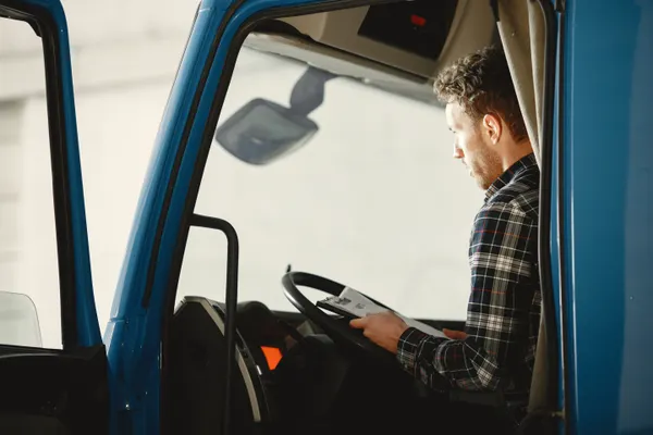 Owner-operator in the cab of his truck